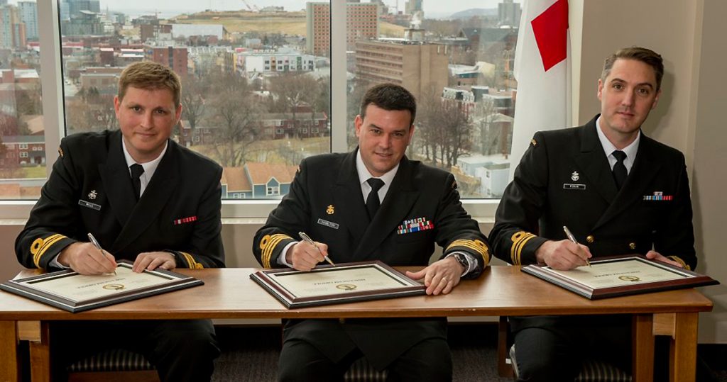 Capt(N) Jeff Hamiliton, Commander 5th Maritime Operations Group, presides over a Change of Command ceremony April 16, as LCdr Drew Foran (right) takes over HMCS Oriole from LCdr Mike Wills (left). Photo by Cpl J.W.S. Houck, FIS