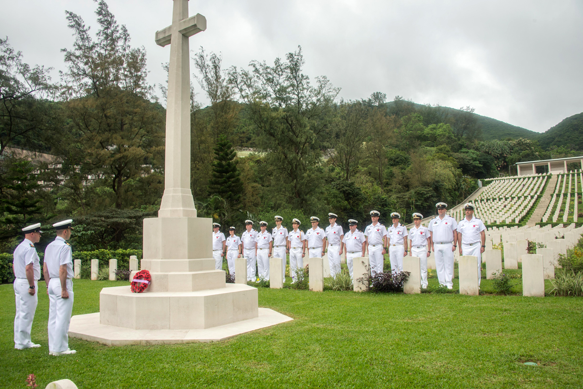 Commanding Officer of HMCS Vancouver, Cdr Christopher Nucci, accompanied by ship’s Coxswain CPO1 Wist, lays a wreath at the Cross of Sacrifice at Sai Wan Cemetery on May 7. Photo by MCpl Brent Kenny, MARPAC Imaging Services
