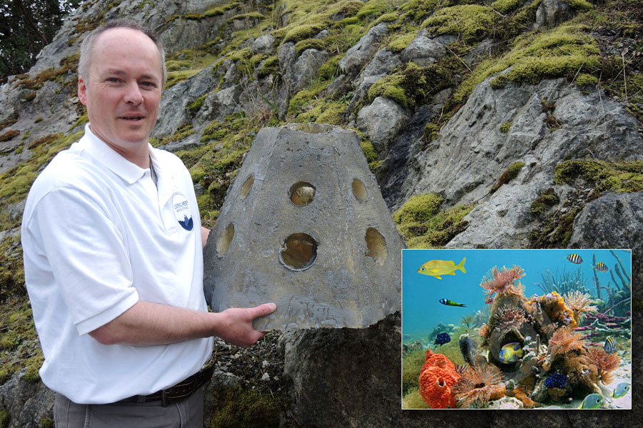 Kevin Owens owner of Ladysmith-based Living Reef Memorial, displays a model of a cement container. Owens fills the real containers with cremated human remains that are then used to build living reef systems on the ocean floor. Photo by Peter Mallett, Lookout