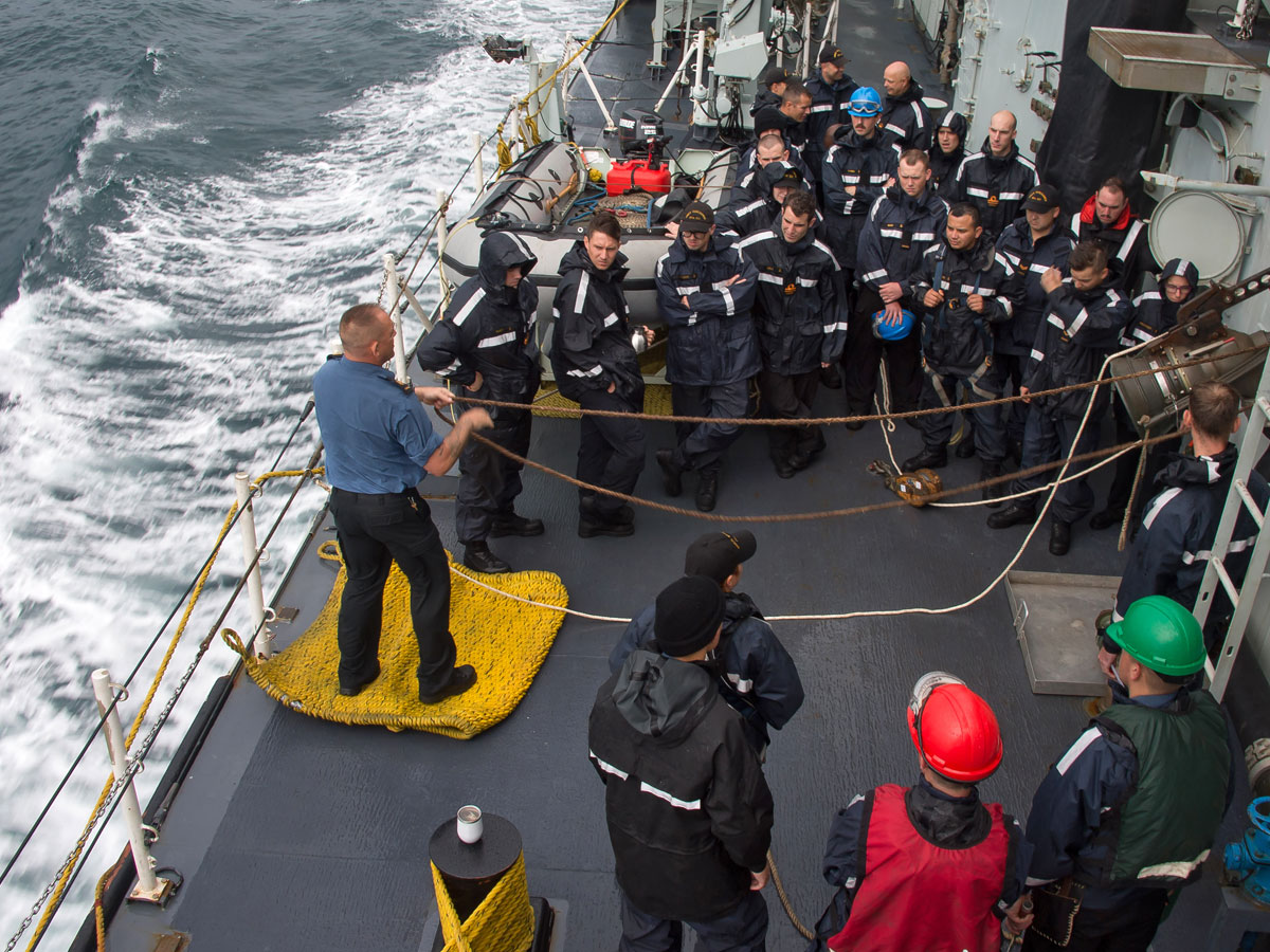 Chief Boatswain Mate, Chief Petty Officer Second Class Horne instructs members of the refueling team on proper procedures during a fueling layout on board HMCS Vancouver. Photo: MCpl Brent Kenny, MARPAC Imaging Services