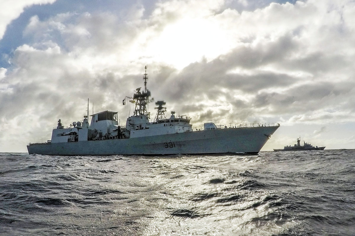 HMCS Vancouver (left) and Her Majesty’s Australian Ship Toowoomba (right) align during Operation Projection Asia Pacific in the Timor Sea, May 28. Photo by MCpl Brent Kenny, MARPAC Imaging Services