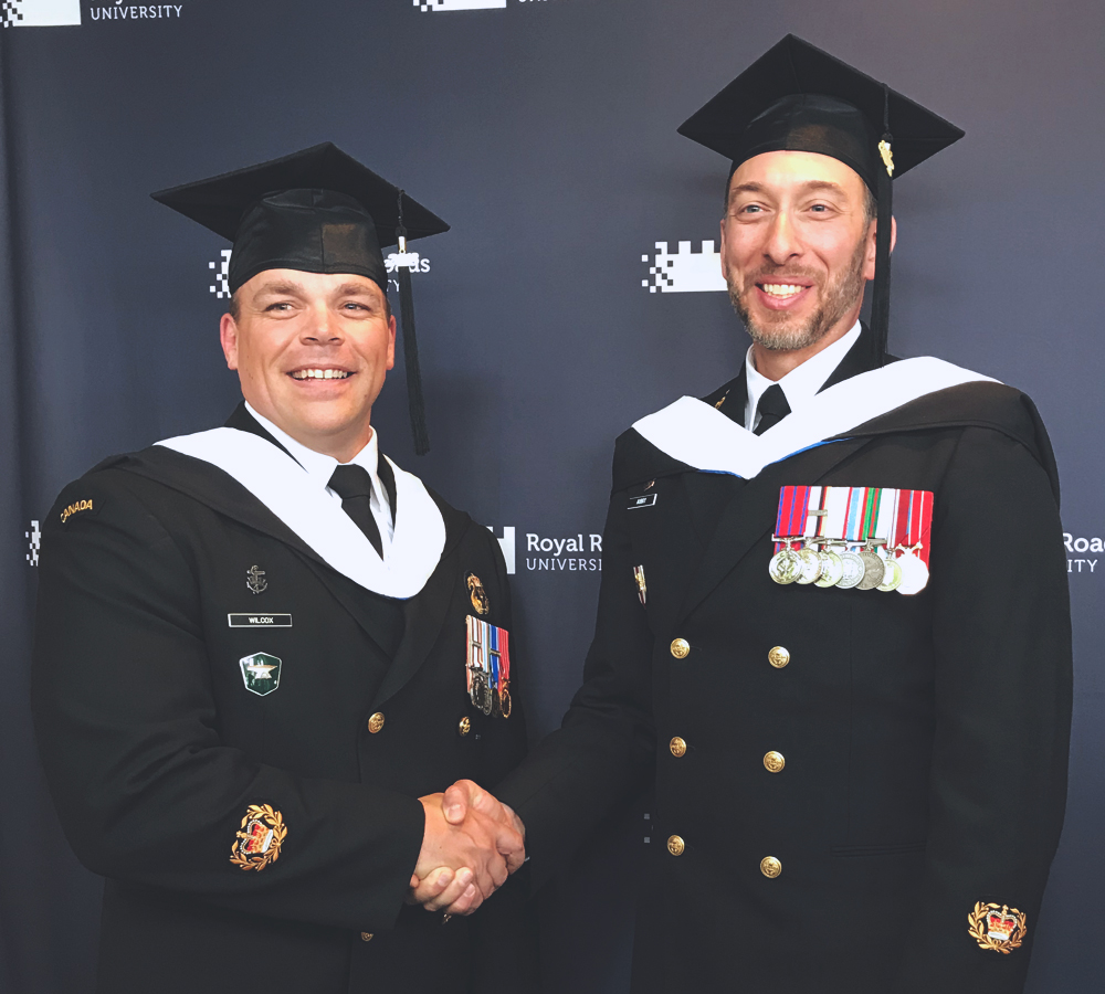 CPO2 Sean (Robert) Wilcox (left) and CPO2 Andre Aubry at their Royal Roads University Convocation ceremony. CPO2 Wilcox graduated with a Master’s Degree in International Leadership and CPO2 Aubry with a Master’s in Leadership.