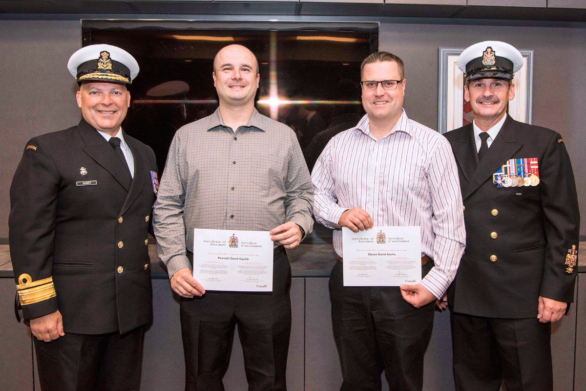 From left: RAdm Craig Baines, Commander Maritime Forces Atlantic, LS Kenneth Squibb, LS Steven Auchu, and Formation Chief, CPO1 Pierre Auger at the re-enrollment ceremony at CFRC Halifax on June 7. Photo by Mona Ghiz, MARLANT PA