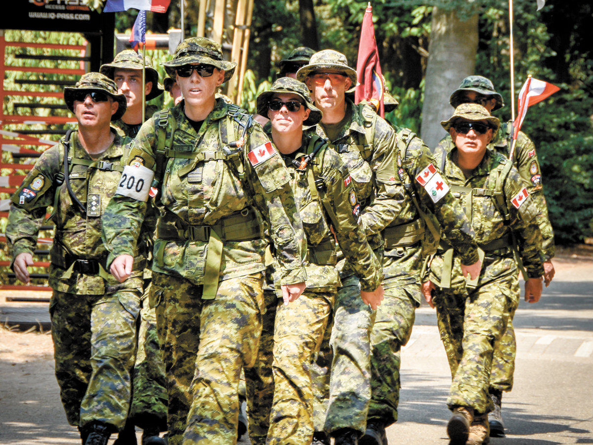 MARPAC Team arrives into Camp Heumensoord at the end of the day’s marching on July 17. Photo by Combat Camera