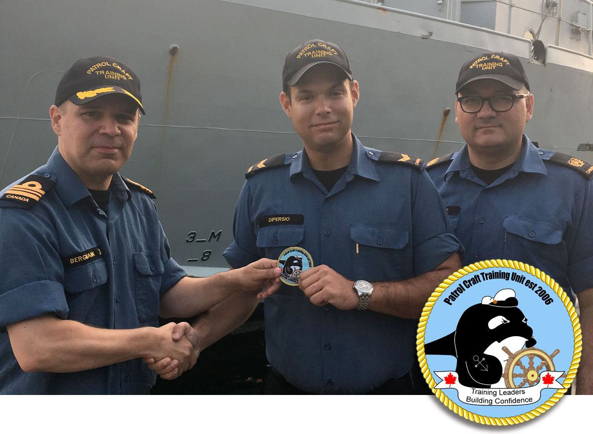 LS Nicholas Dipersio (centre) presents the unit’s new morale patch that he designed to LCdr Tyson Bergmann, Patrol Craft Training Unit (PCTU) Commanding Officer, and CPO2 Eric Pohoney, PCTU Coxswain.