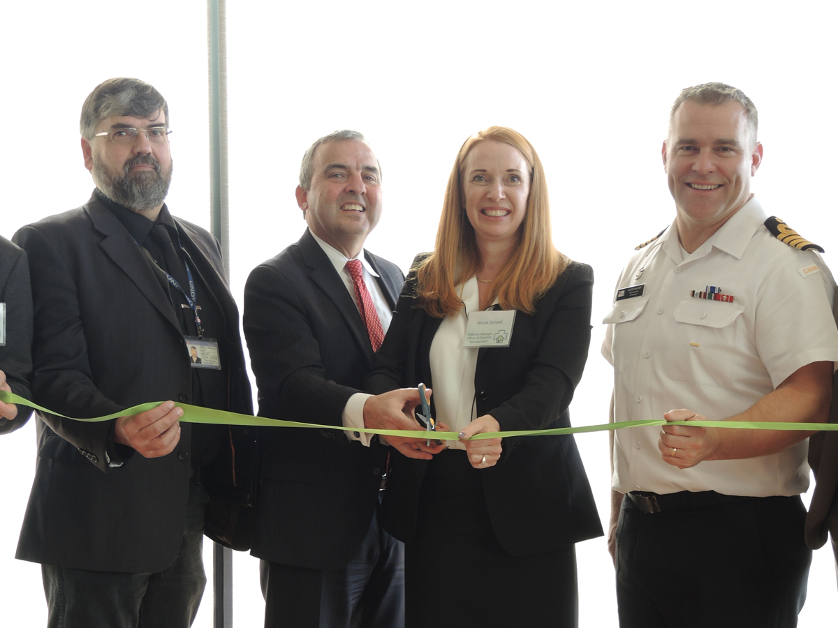 Mark Miller, UNDE; Glenn MacDougall, Acting DGWM; Nicole Schaaf, Office of Disability Management, and Capt(N) Jason Boyd cut the ribbon marking the regional office of Disability Management opening. Photo by Peter Mallett