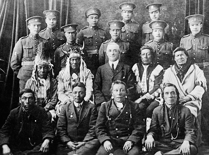 Elders and Indigenous soldiers in the uniform of the Canadian Expeditionary Force circa 1916-17.