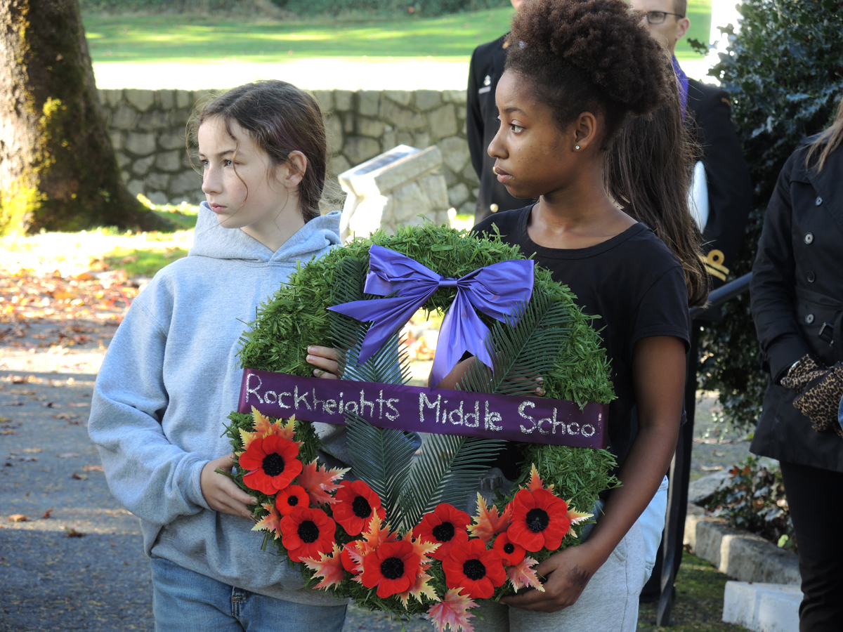 Wreath bearers from Rockheights Middle School take part in a moment of silence. Photo by Peter Mallett, Lookout