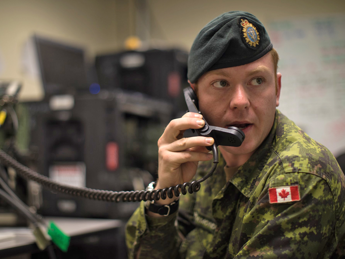 Cpl Ryan Plamondon of 39 Signal Regiment, B Squadron Nanaimo, listens to High Frequency (HF) radio chatter during Exercise Noble Skywave.