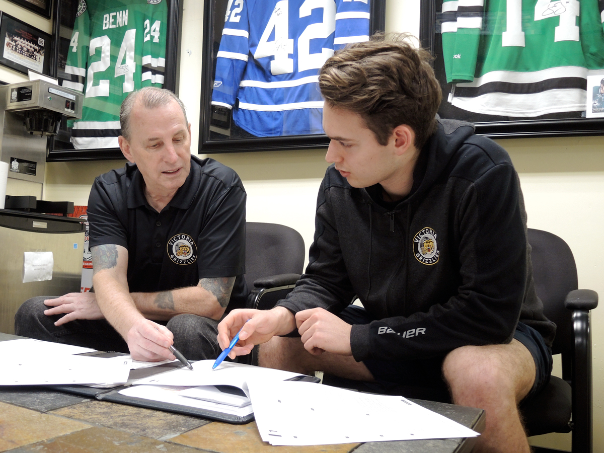 Victoria Grizzlies Educational Advisor Butch Boucher (left) gives advice to Grizzlies right-winger Marty Westhaver in the team’s head office at the Q-Centre in Colwood. Photo by Peter Mallett, Lookout