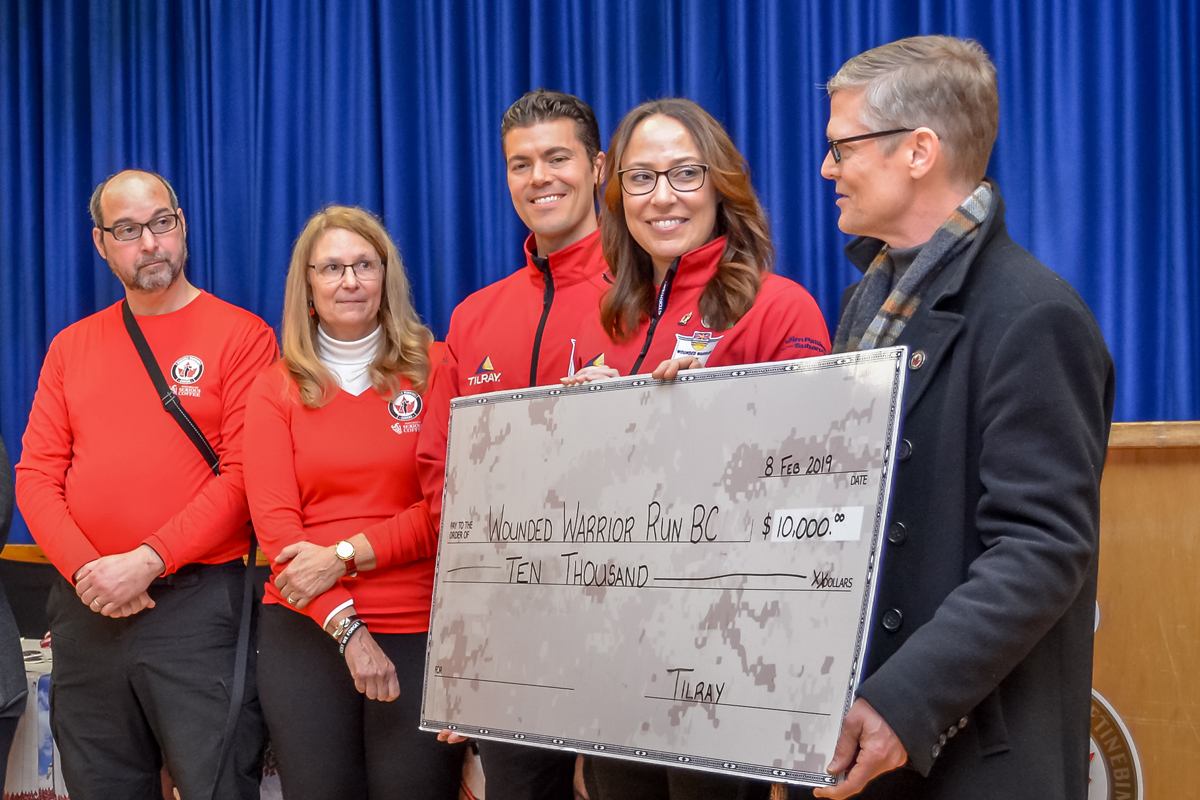Philippe Lucas (right), Vice President Global Patient Research and Access representative with title sponsor Tilray, presents a cheque for $10,000 to Wounded Warrior Run BC members PO2 (Retired) Stephane Marcotte, Susan Marcotte, Matt Carlson and Wounded Warrior Run Director Captain Jacqueline Zweng. Photo by J. Kacki Photography