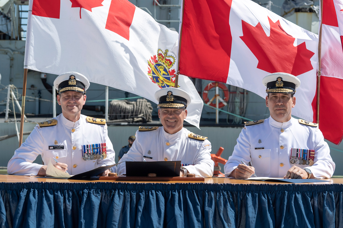 From left, outgoing Commander Canadian Fleet Atlantic, Cmdre Skjerpen; RAdm Craig Baines, Commander Maritime Forces Atlantic, with incoming Commander Cmdre Richard Feltham at the Change of Command ceremony July 11. Photo by Cpl David Veldman, FIS