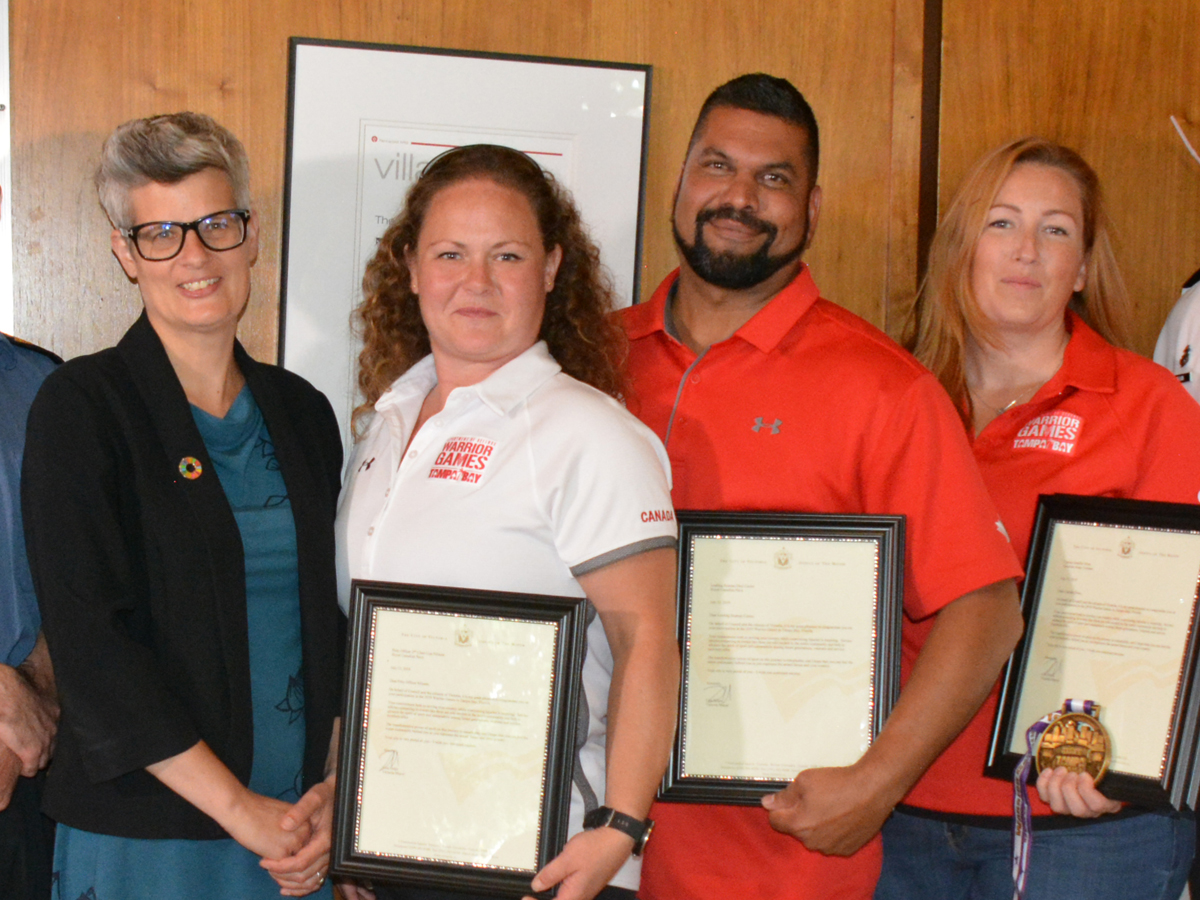 City of Victoria Mayor Lisa Helps presents PO2 Lisa Nilsson, LS Desi Cozier and Capt (Retired) Jennifer Sizer with Letters of Appreciation prior to a ceremony at Victoria City Hall, July 15.