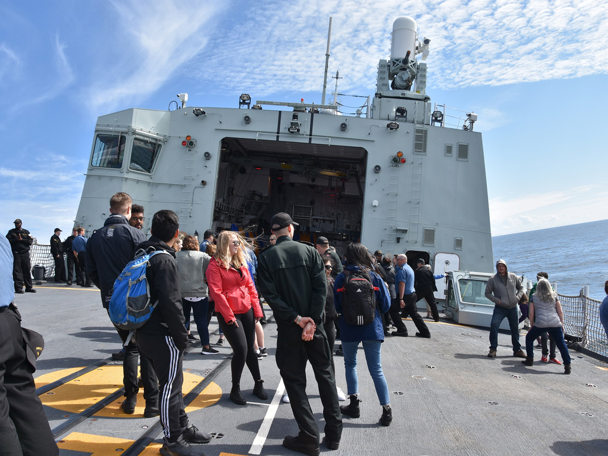 Family and friends enjoy manoeuvres on board HMCS Winnipeg during the family day sail.