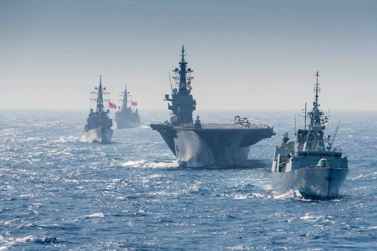 HMCS Regina conducts manoeuvres with NRU Asterix and the Japenese military during Operation PROJECTION on June 13th. Photo by Japanese Image Technician. Edited by Corporal Stuart Evans, BORDEN Imaging Services