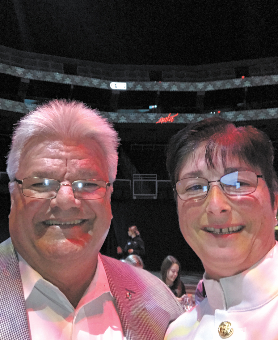 CPO1 Line Laurendeau of Canadian Fleet Pacific Operations poses for a selfie with NHL legend Marcel Dionne during the Gala Dinner.