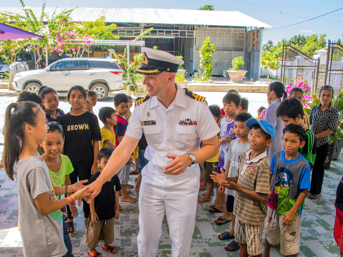 HMCS Regina's Commanding Officer Commander Jacob French joins Deborah Paul, the Ambassador of Canada to Vietnam, with members of the crew for a visit to the Hope Orphanage, Nhan Ai shelter in Khanh Hoa, Vietnam during Operation Projection on June 11. Photo by Corporal Stuart Evans, Borden Imaging Services