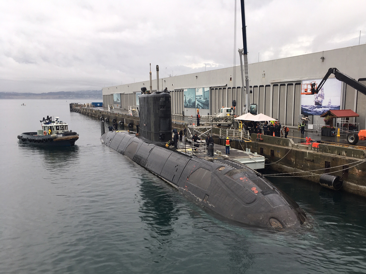 Jetty Services staff from Port Operations and Emergency Branch work to secure Victoria-Class submarine HMCS Chicoutimi before Defence on the Dock at Ogden Point on Sept. 15. Photo by POESB
