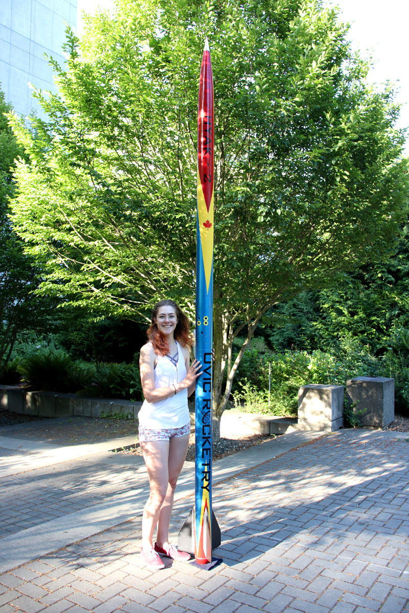 Kelsey Towers-Jones shows off a Hyak-2 rocket used in competition by the UVic Rocketry club. The rocket reached a speed of 2,200 km/h, or Mach 1.8, during a recent competition. Towers-Jones is currently doing a cooperative education placement at Fleet Maintenance Facility Cape Breton. Photo courtesy UVic Rocketry