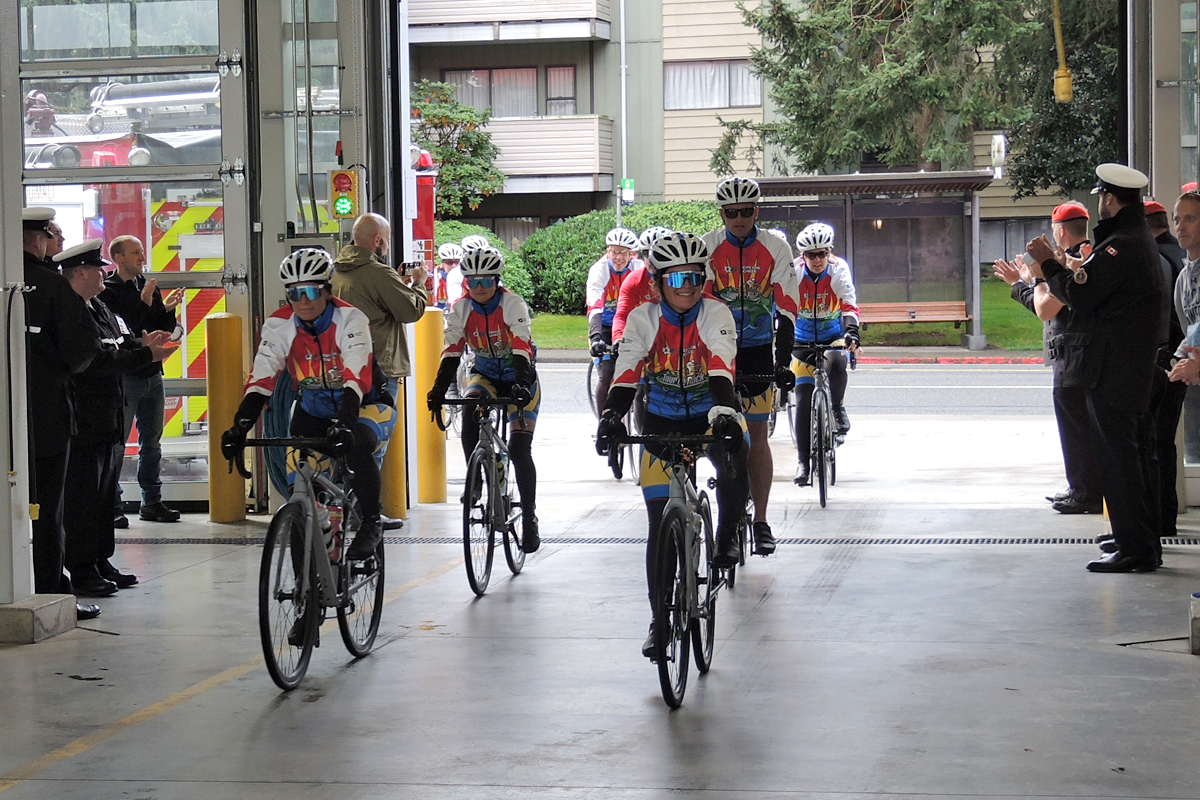 Tour de Rock riders make their way into CFB Esquimalt Fire and Rescue during a tour stop on at CFB Esquimalt Fire and Rescue hall. Photo by Peter Mallett, Lookout