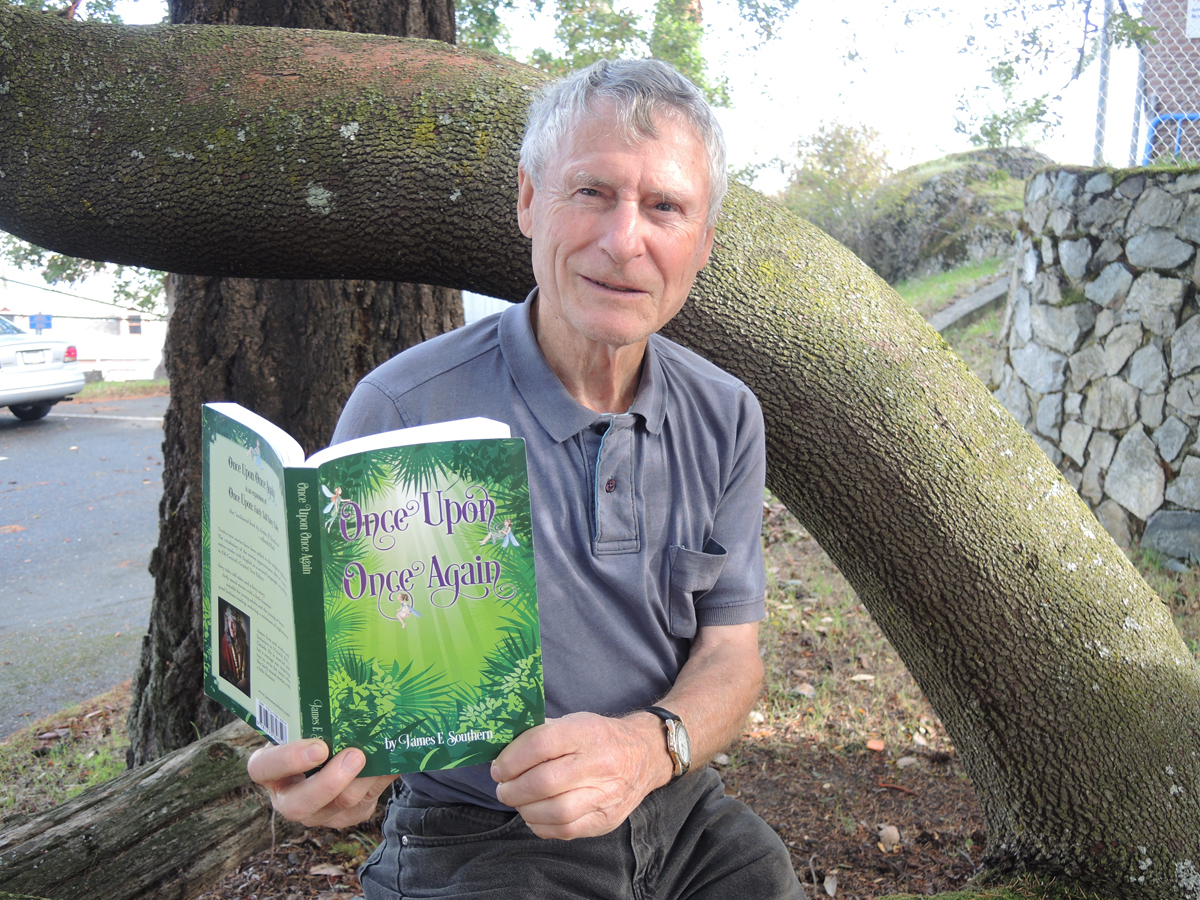 Author James Southern displays a copy of his book Once Upon Once Again. Photo by Peter Mallett