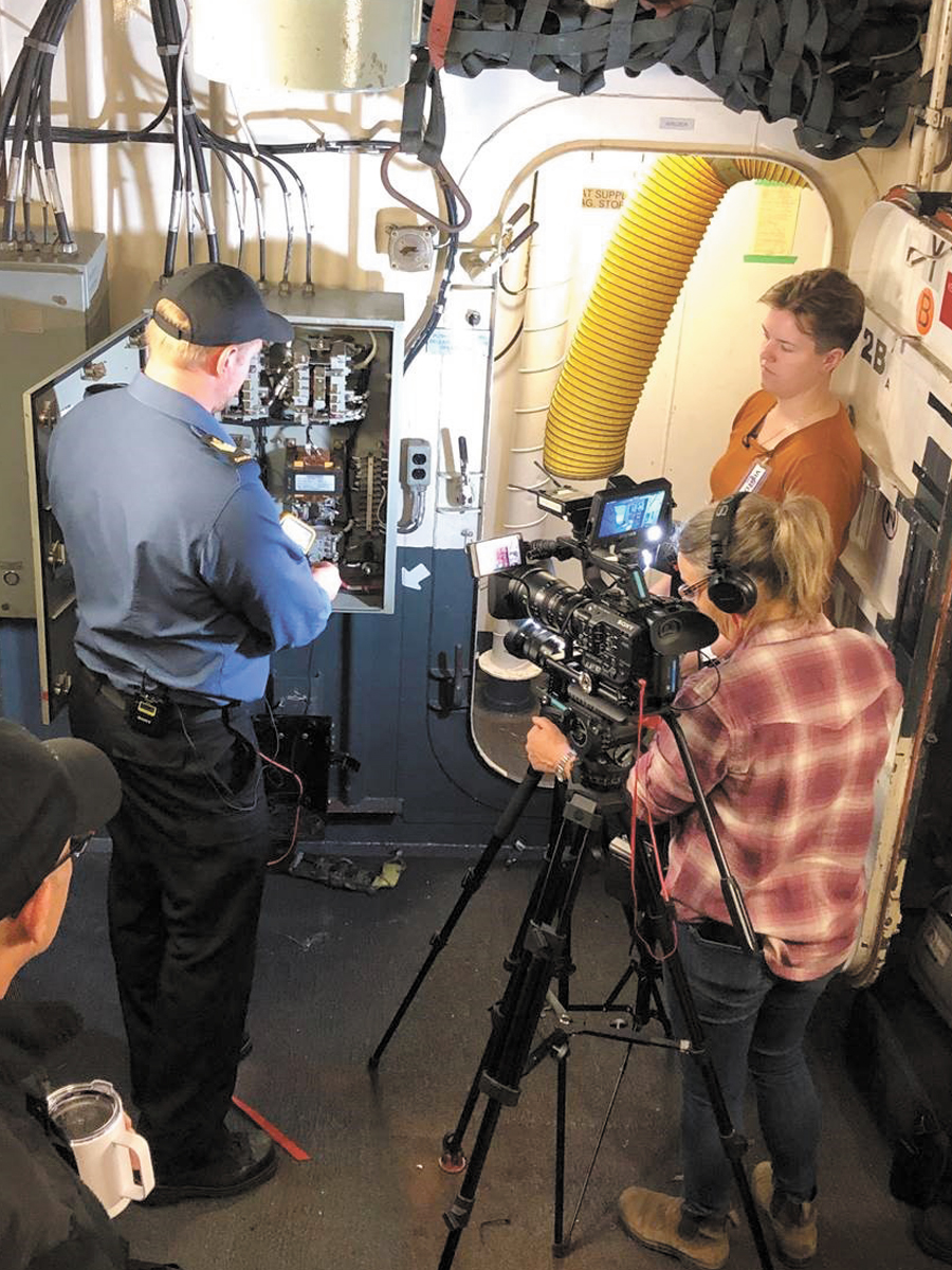 PO2 Gillies from Naval Personnel Training Group assists in the filming of a training video with a film crew from Race Rocks 3D. Photo by PO1 Beaulieu