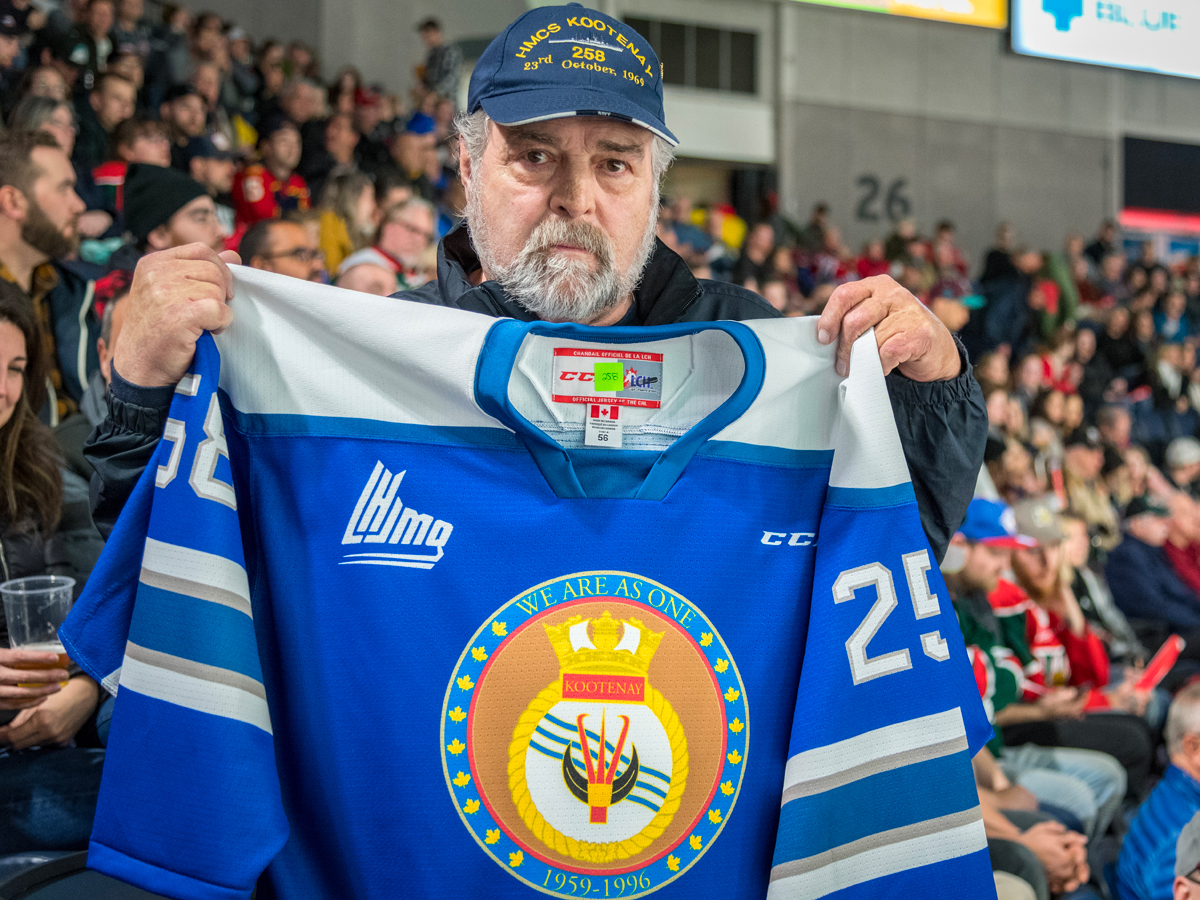 LS (Retired) Allan “Dinger” Bell shows off this year’s special Mooseheads jersey design honouring HMCS Kootenay. Photo by Cpl David Veldman, FIS Halifax