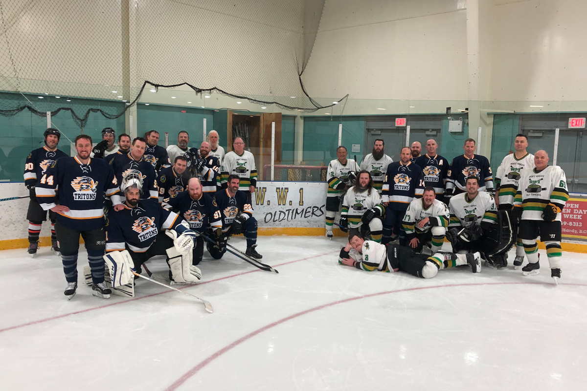 Players for the CFB Esquimalt Tritons and Port Hardy’s ‘World War One’ team gather for a group photo following the completion of their two-game series.