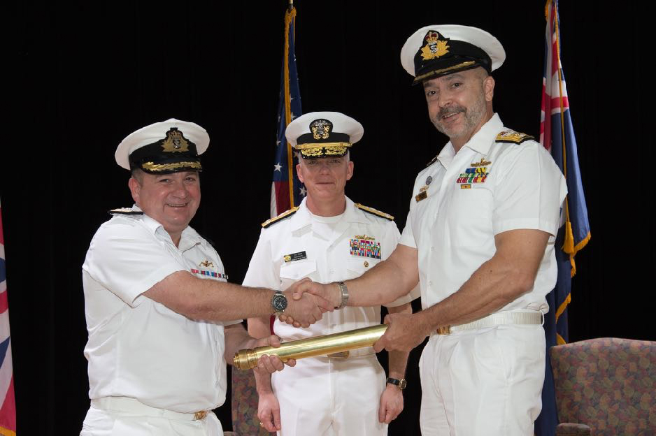 Commodore Ed Ahlgren, Royal Navy (Left) relinquishes command of Combined Task Force 150 to Commodore Ray Leggatt, Royal Australian Navy (right) during a ceremony at Combined Maritime Forces Headquarters in Manama, Bahrain. The change of command was presided over by Commander Combined Maritime Forces Vice Admiral James Malloy (centre).