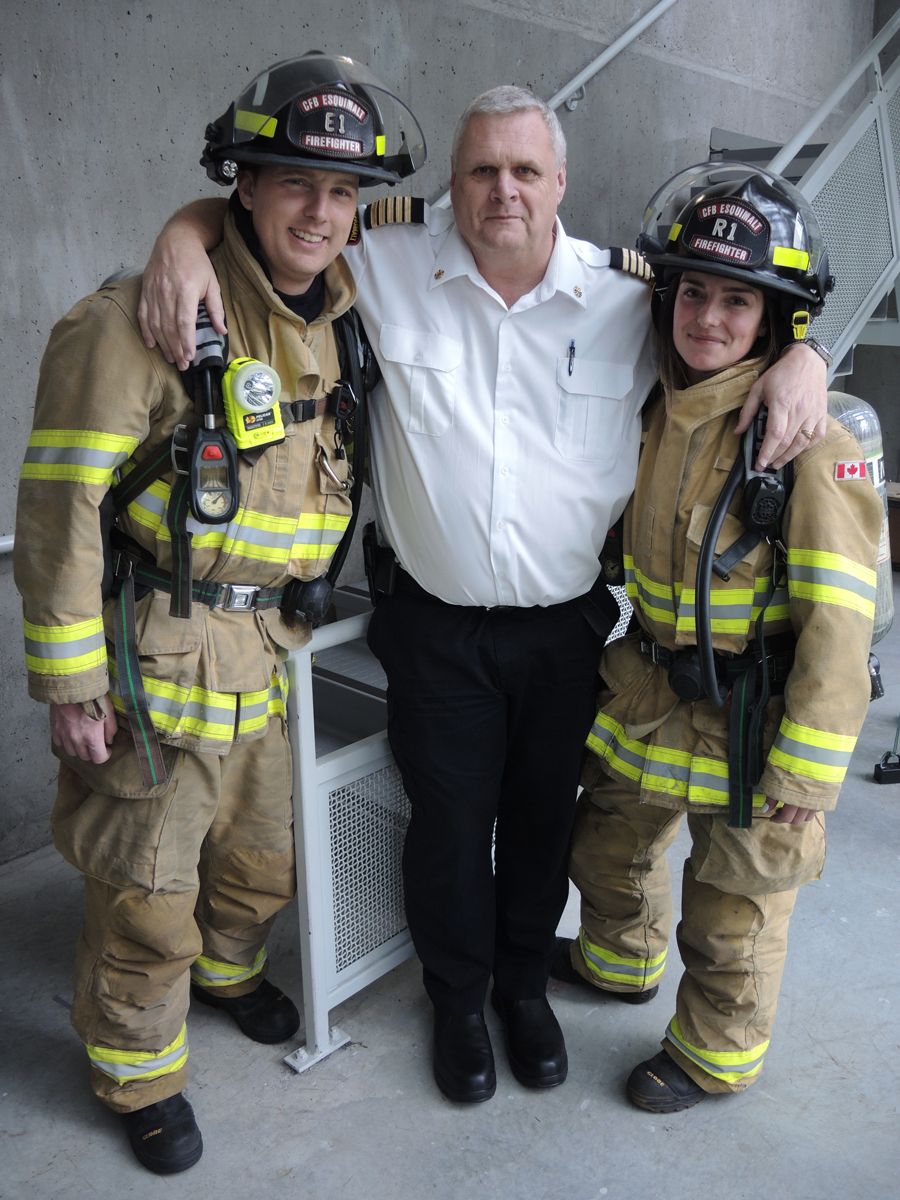 Members of CFB Esquimalt Fire and Rescue’s Climb the Wall team, Alexandria Marshall and Mike Gordon are joined by Fire Chief Geordie Douglas. Douglas stopped by to show his support while the pair were practicing for their upcoming competition. The two are part of a five-person team who will be among 200 firefighters participating in a fundraiser for the Lung Association at the Sheraton Vancouver Wall Centre. Photo by Peter Mallett, Lookout