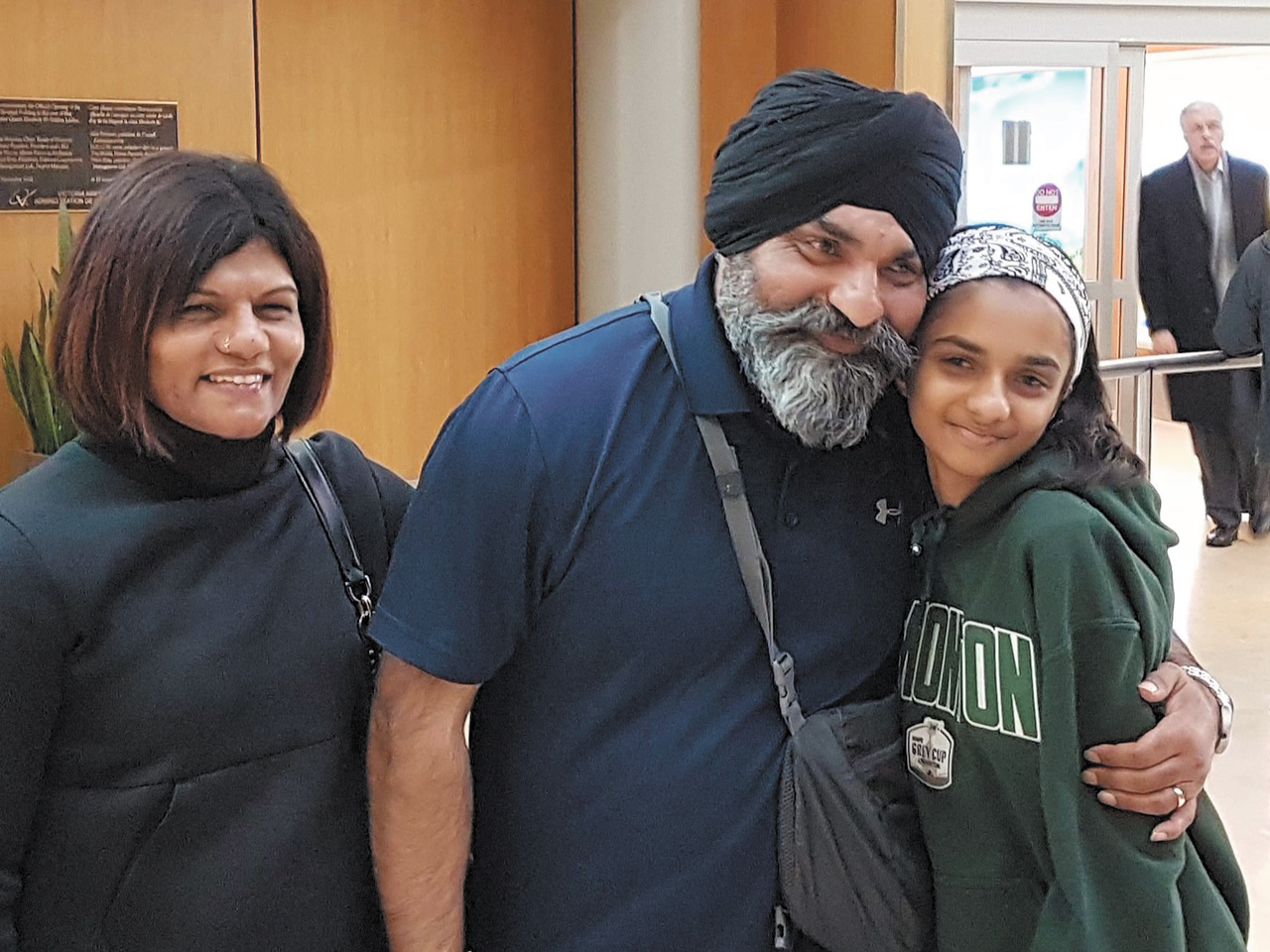 PO2 Kanwar Nijjer is greeted by his wife Gurdeep Nijjer and his daughter Sadbd Nijjer after returning from Operation Impact in Baghdad.Photo courtesy PO2 Kanwar Nijjer