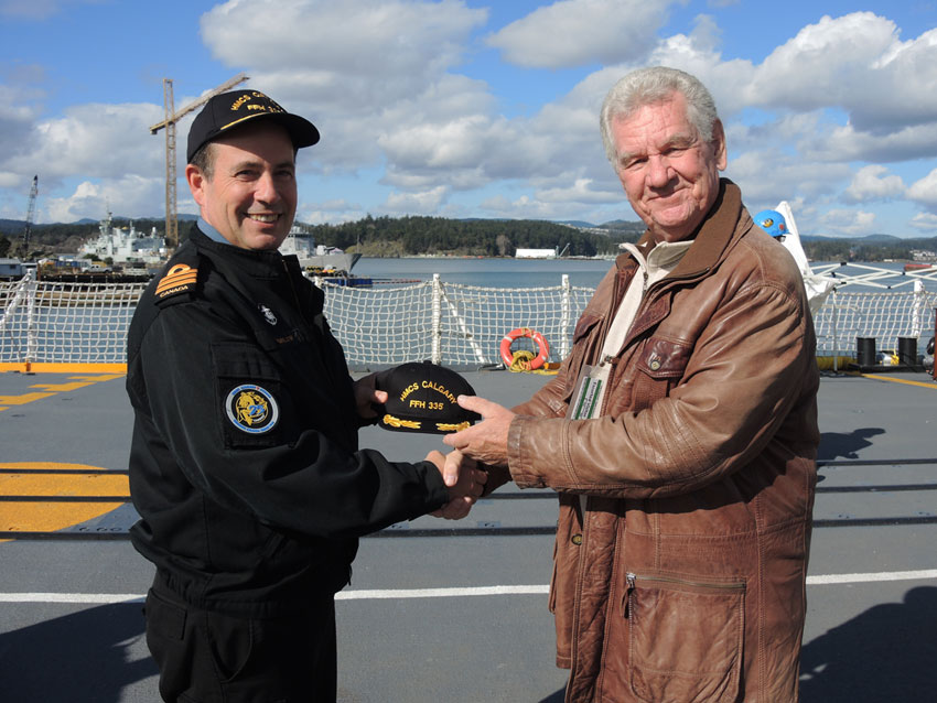 HMCS Calgary Commanding Officer, Cdr Alex Barlow welcomes David McLean aboard for a tour of the warship. Cdr Barlow presented an official captain’s hat and coin to McLean to be given to his 100-year-old father Leslie McLean. McLean sailed aboard the original HMCS Calgary vessel during the Second World War. Photo by Peter Mallett, Lookout