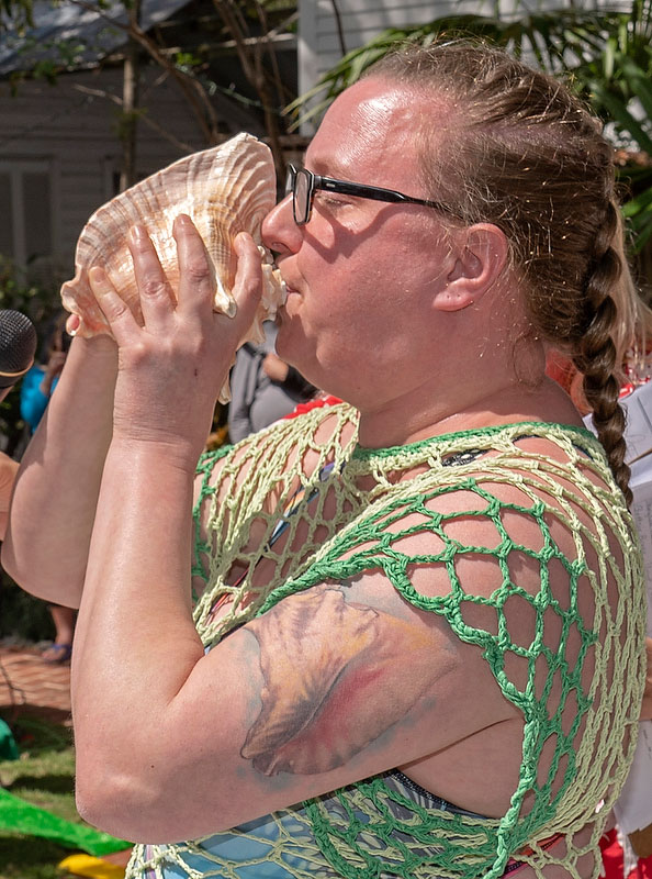 PO2 Alliszon Zaichkowski toots her conch shell during the annual Key West Conch Shell Blowing Contest Saturday, March 7 in Florida. She won top honours by impressing the judges with excerpts from several melodies including composer Igor Stravinsky’s “The Firebird” and Queen’s “Bohemian Rhapsody.” Photo by Rob O’Neal, Florida Keys News Bureau/HO