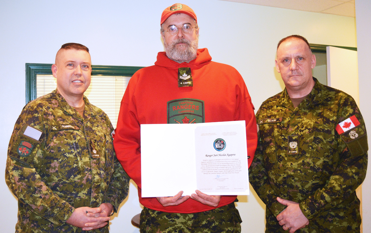 Major Geoff Robinson, left, and Major Master Warrant Officer Donald Clark, right, present the Joint Task Force Pacific Command Commendation to Canadian Ranger Master Corporal Juri Agapow of the Quesnel Canadian Ranger Patrol. Photo by Canadian Ranger Lindsay Chung, Quesnel Canadian Ranger Patrol