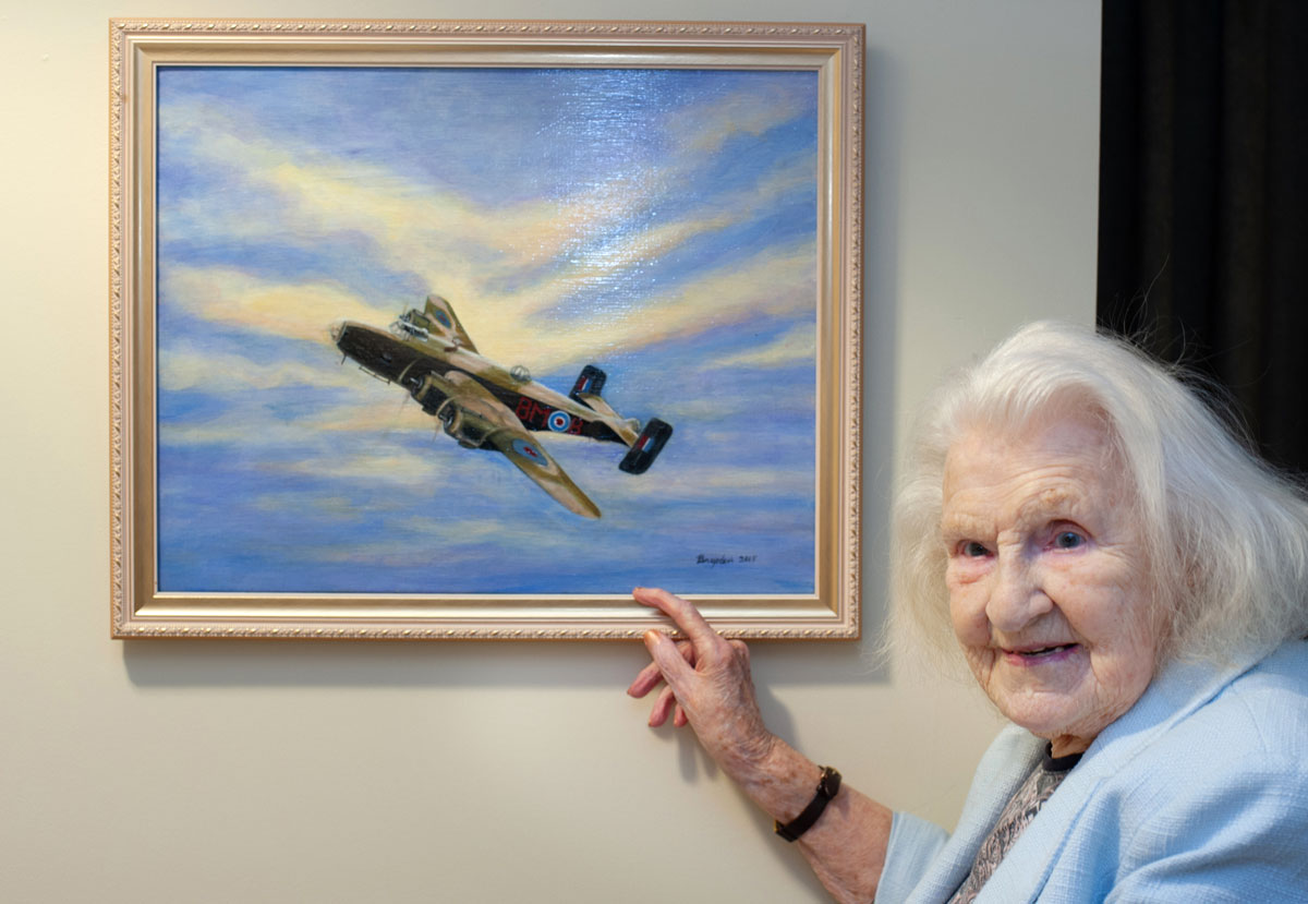 During the Second World War, Olive Bailey worked in a factory that made engines for the Halifax bomber, shown here in a picture she painted.