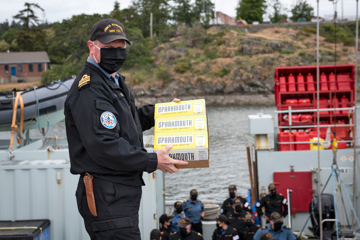 HMCS Nanaimo returned from Operation Laser May 22. Members of the crew received SPARKMOUTH drinks as they disembarked. Photo by Leading Seaman Valerie LeClair, MARPAC Imaging Services