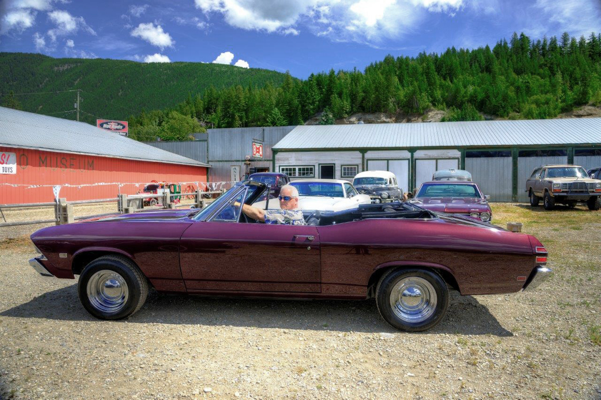 Former Navy Lieutenant Rex Landis behind the wheel of a 1968 Pontiac Beaumont convertible, completely rebuilt by the Rust Valley Restoration crew.