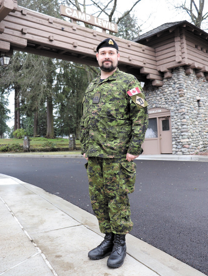 Naval reservist Lieutenant (Navy) Joseph Kinley at the main gate of Joint Base Lewis-McChord after completing Warfighter Exercise 20-3 Feb. 13, just before COVID-19 became a pandemic. Photo Credit Sergeant First Class James Lally