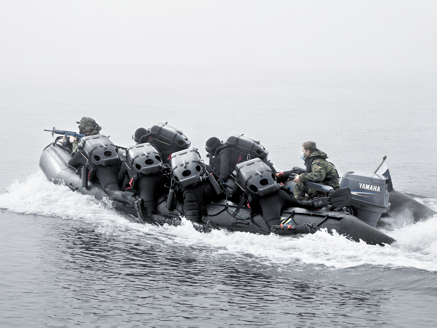 Clearance Divers in-training  practice covert insertion into an enemy held beachfront to search for sea mines.