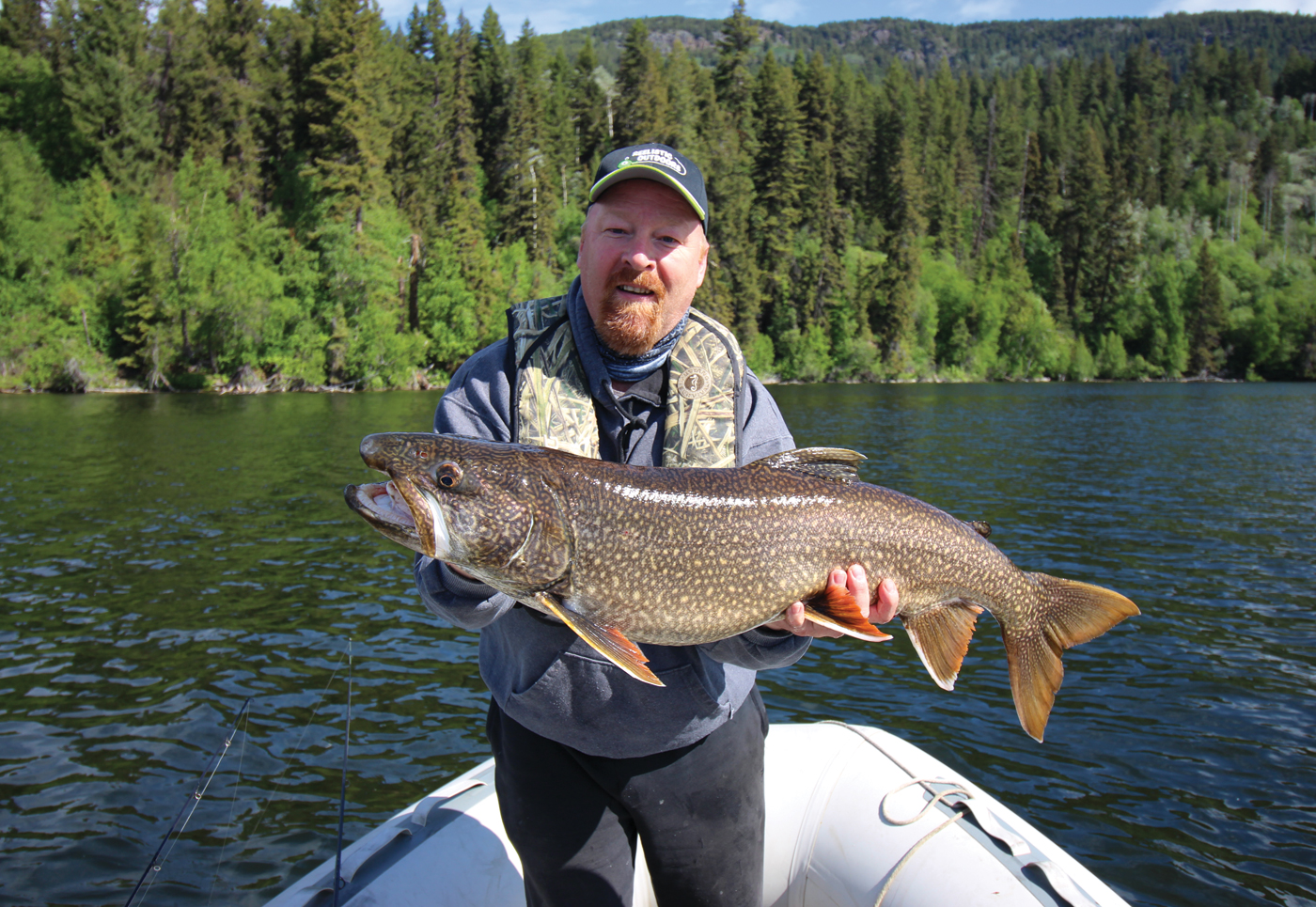 Scott Stewart, host of fishing show Reelistic Outdoors, displays a Lake Trout he caught in June 2018 on Cunningham Lake, B.C. Stewart, a lifelong fisherman and conservationist, says he tries to return each fish he catches safely back to the water. Photo by Jeff Christensen