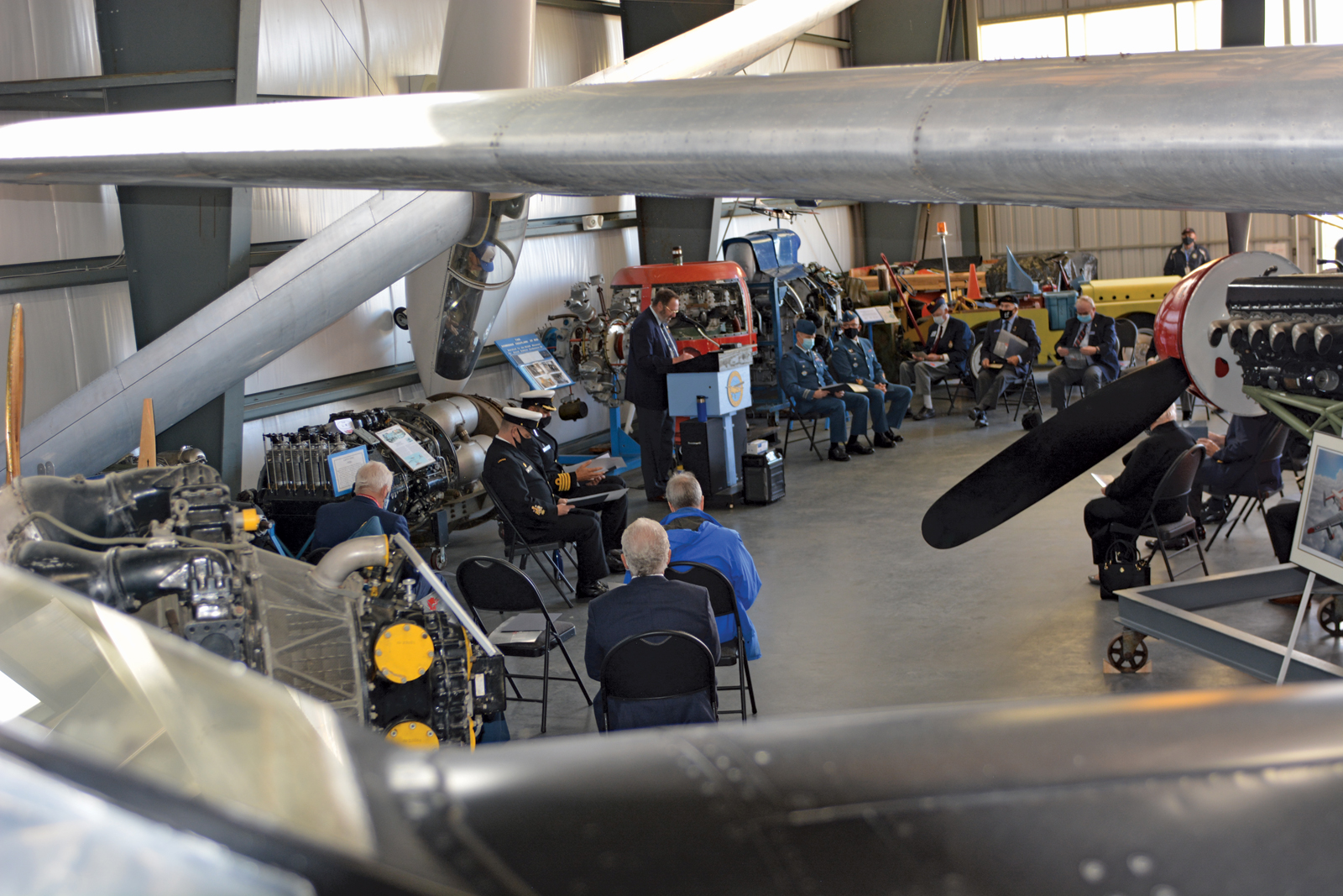 Military members past and present, following health and safety protocols, gathered at the B.C. Aviation Museum for a ceremony to commemorate the 100th anniversary of first trans-Canada flight. Photo by CFB Esquimalt Base Public Affairs