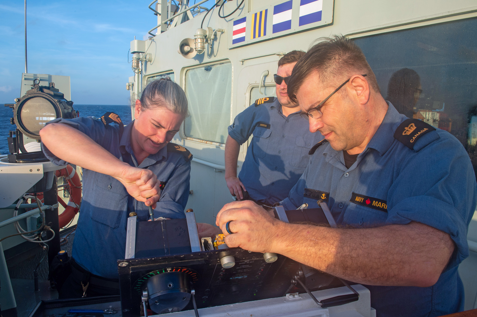 Royal Canadian Navy members work on the helm console of HMCS Summerside during Operation Caribbe in the Atlantic Ocean on Oct. 29. Members are not named for operational security purposes. Photos by Lt Sheila Tham, Public Affairs Officer
