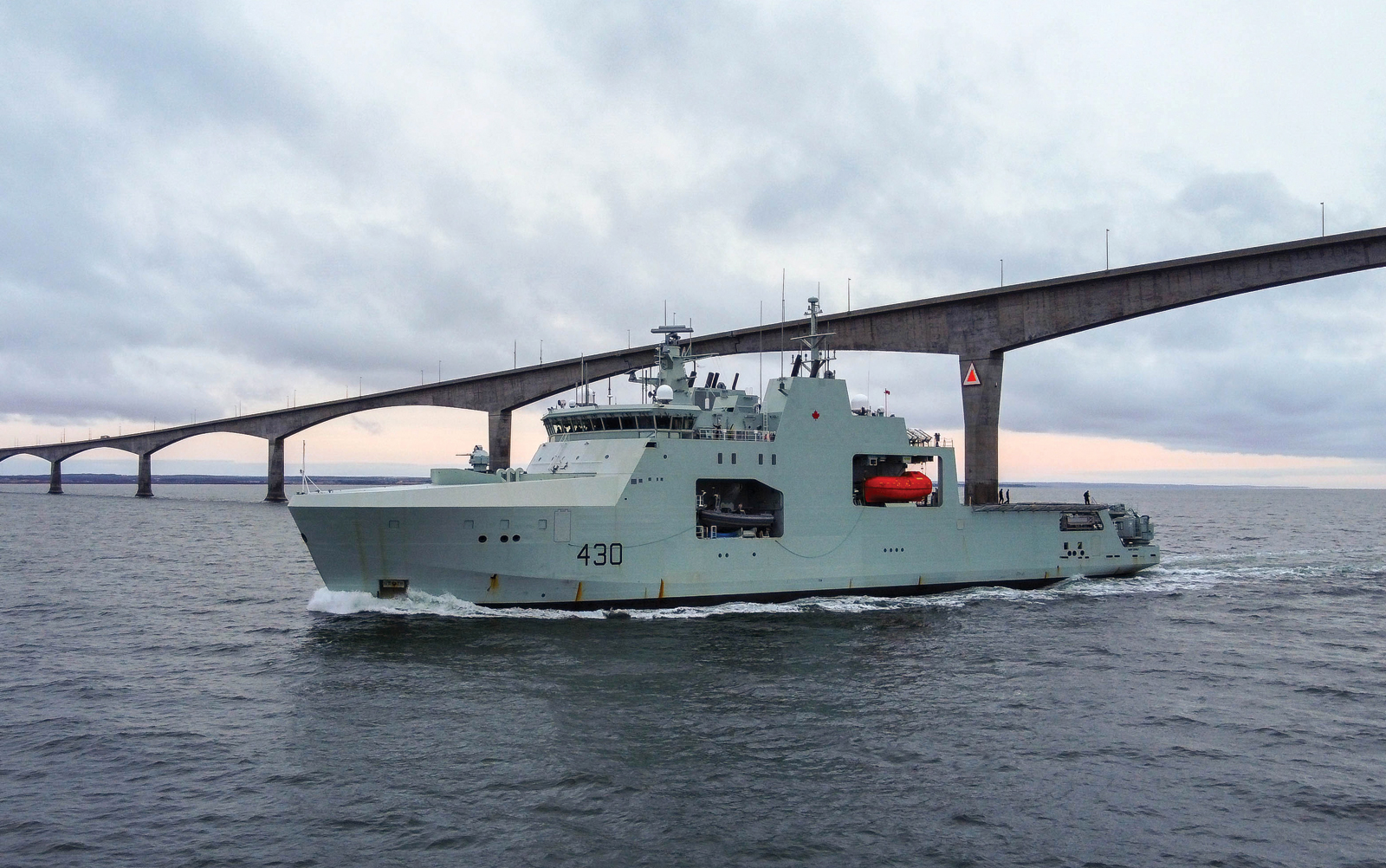 Harry DeWolf sails under the Confederation Bridge between Prince Edward Island and New Brunswick. Photo by Corporal David Veldman, Canadian Armed Forces