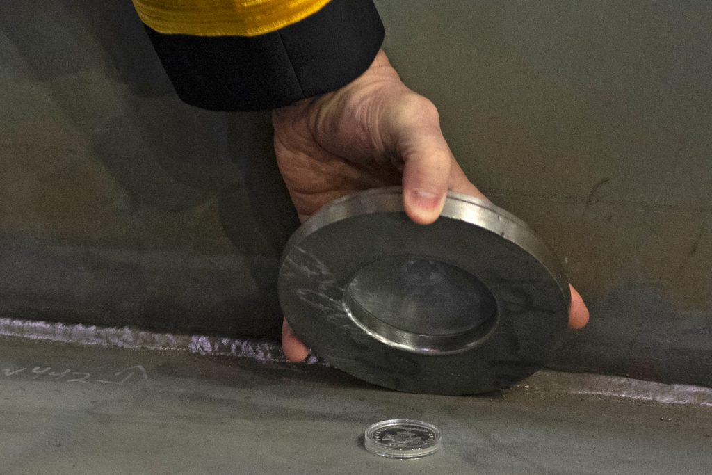 The keel laying is a naval tradition that, in modern times, involves welding a coin into a large piece of the ship’s frame. 