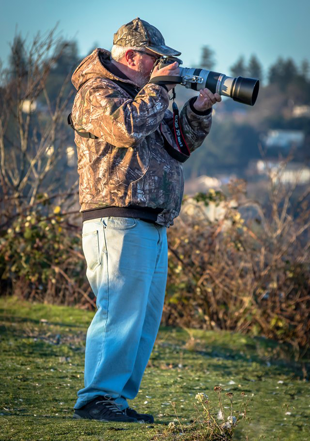 Local photographer Richard Paddle aims his camera at Esquimalt Harbour. Over the years he has photographed dozens of navy vessels along with a wide range of other subjects.