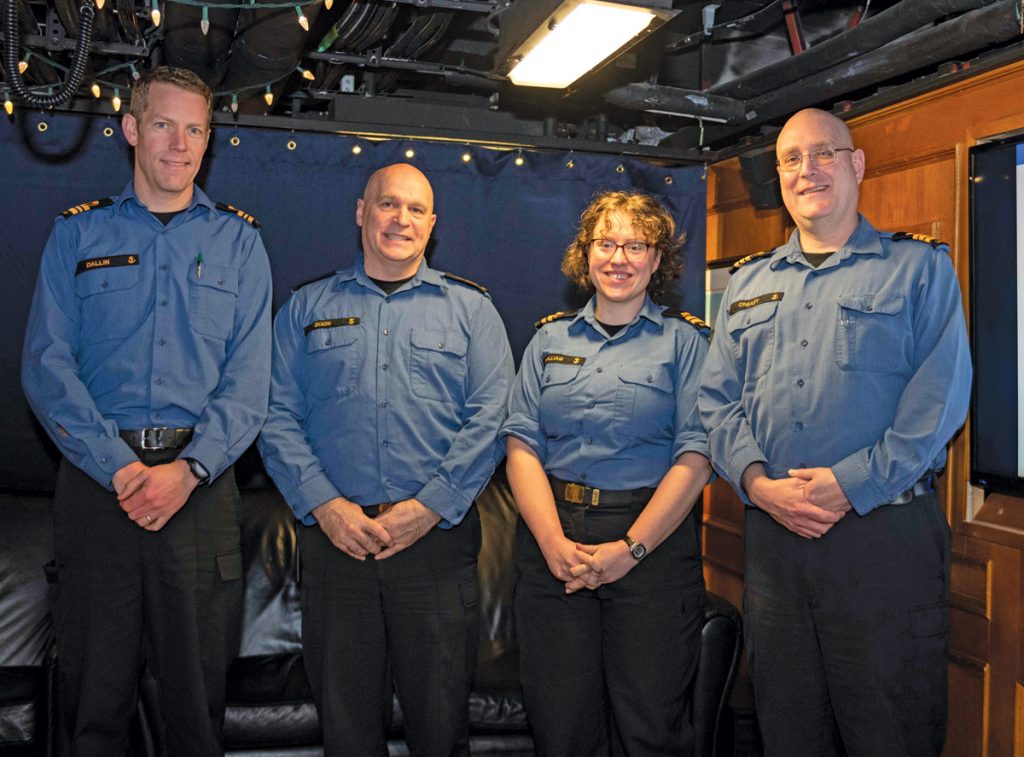 Lieutenant Commander David Dallin (left), Chief Petty Officer Carl Dixon (centre left), Lieutenant(N) Blythe McWilliam, the new Command Cultural Advisor, and Cdr Landon Creasy (right) at the Command Culture Advisor Townhall to brief new members of the ship’s company. Photo by S1 Lisa K. Wallace, Canadian Armed Forces Photo