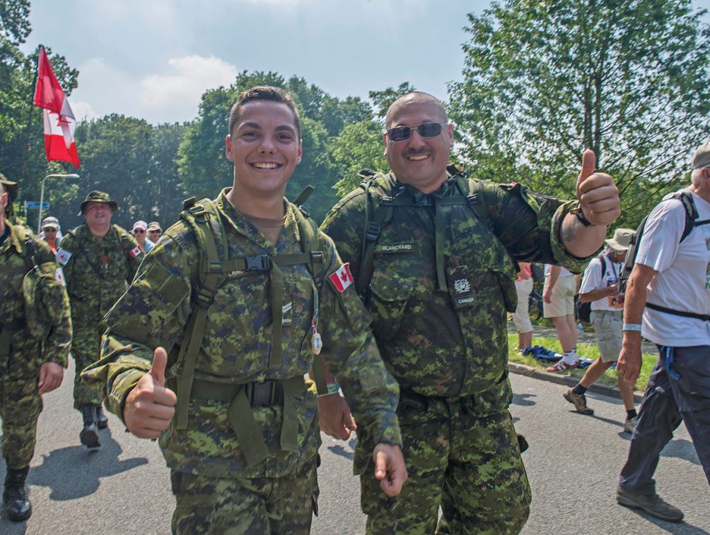 Photo: Father and son, Bruce (right) and Derick Blanchard, march side-by-side during Day 3 of the marches at Groesbeek in the Netherlands on July 21, 2016. Credit: LS Brad Upshall, 12 Wing Imaging Services, Shearwater, N.S
