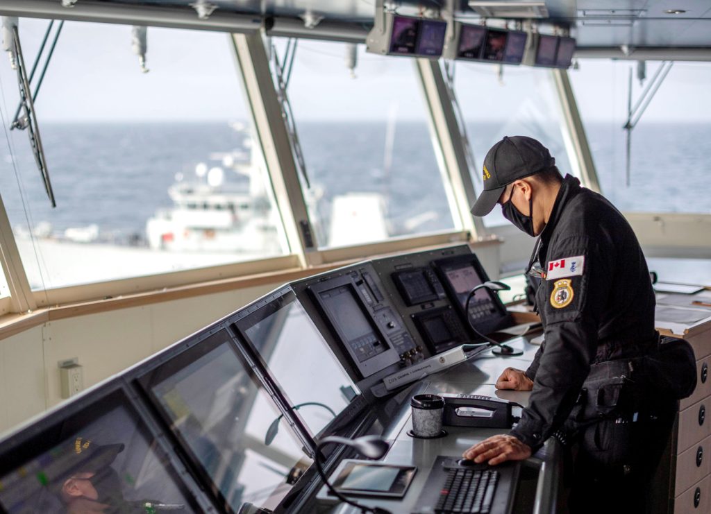 Lt(N) Joseph Chen works on the bridge of HMCS Harry DeWolf.