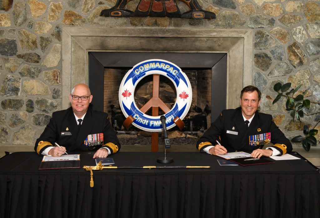 Rear-Admiral Angus Topshee, Incoming Commander of Maritime Forces Pacific / Joint Task Force (Pacific) (MARPAC/JTF (P)), assumes command from Vice-Admiral Bob Auchterlonie, Outgoing Commander, during the Change of Command ceremony for MARPAC/JTF (P) on May 14.