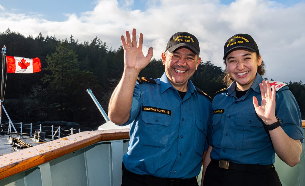 S1 Ivan Vanegas Lopez, a Marine Technician aboard HMCS Calgary, stands with his daughter, S1 Susana Vanegas Tobon, a Human Resources Administrator aboard the ship. Photo by Cpl Lynette Ai Dang, Imagery Technician